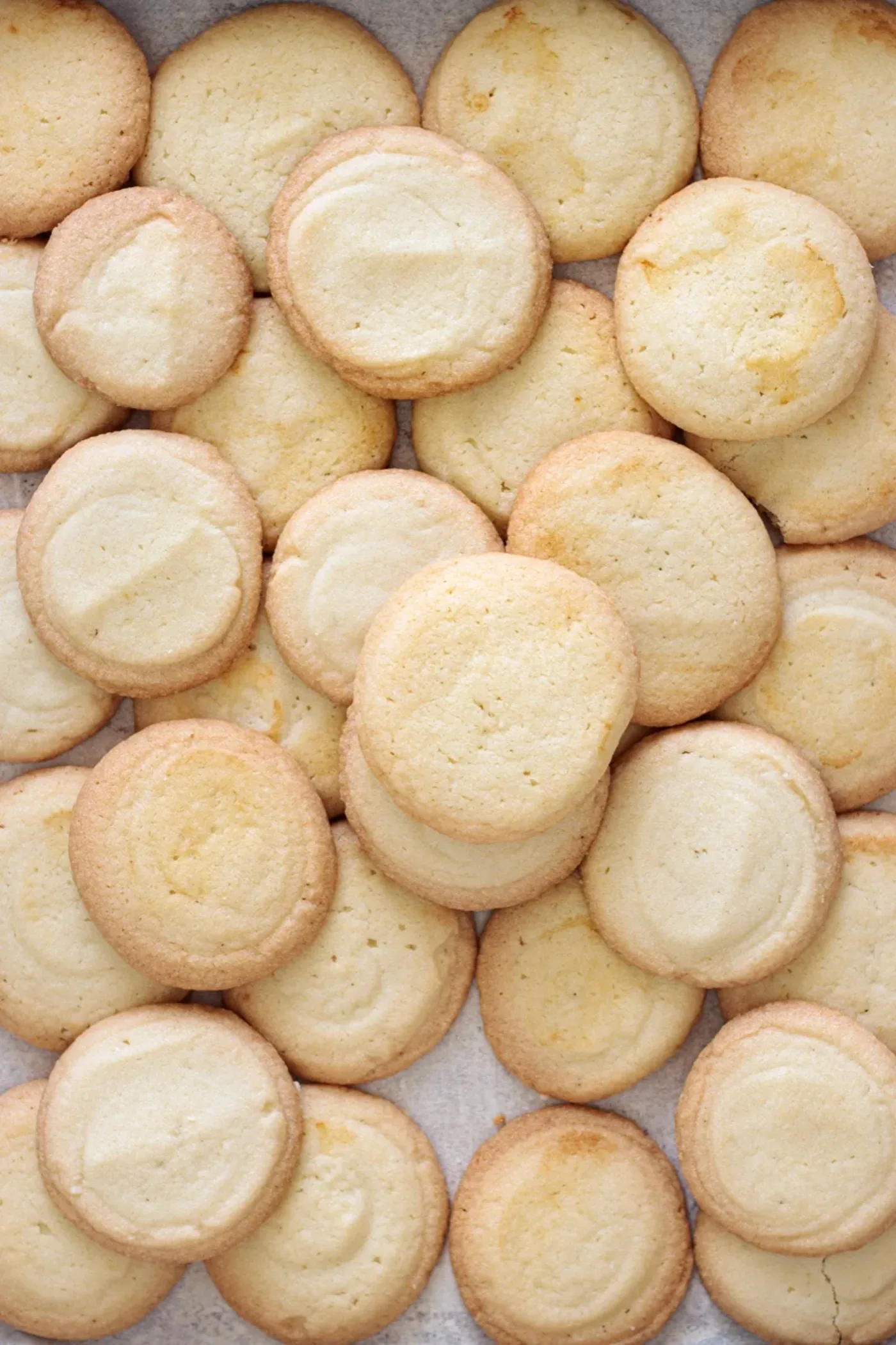 Golden baked butter cookies arranged close together