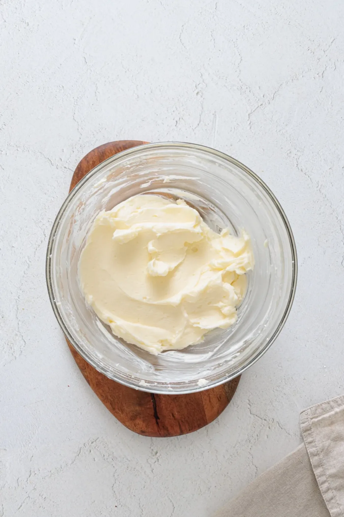 Pale creamed butter and sugar in a glass bowl