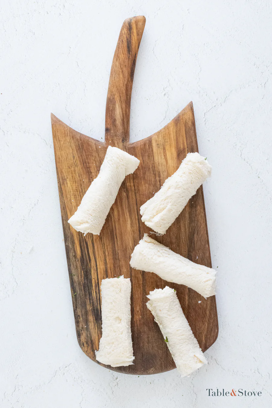 Five cream cheese-filled bread slices rolled into cylinders