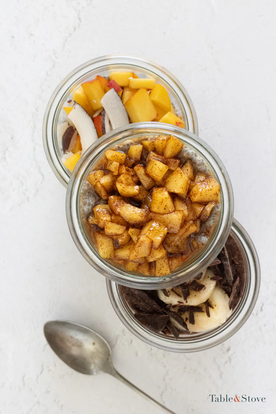 Three finished chia pudding jars seen from above