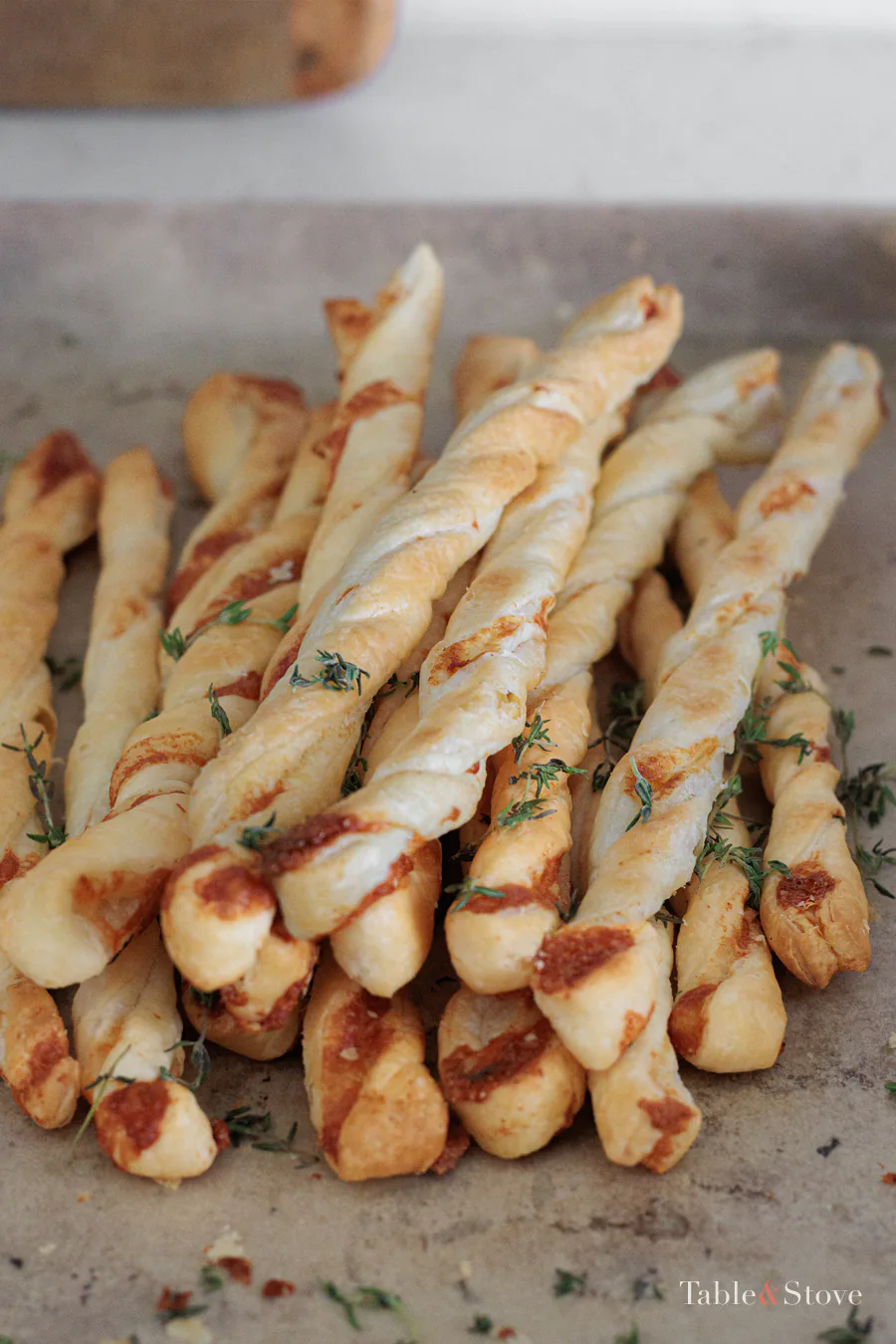 Pile of baked garlic Parmesan puff pastry twists