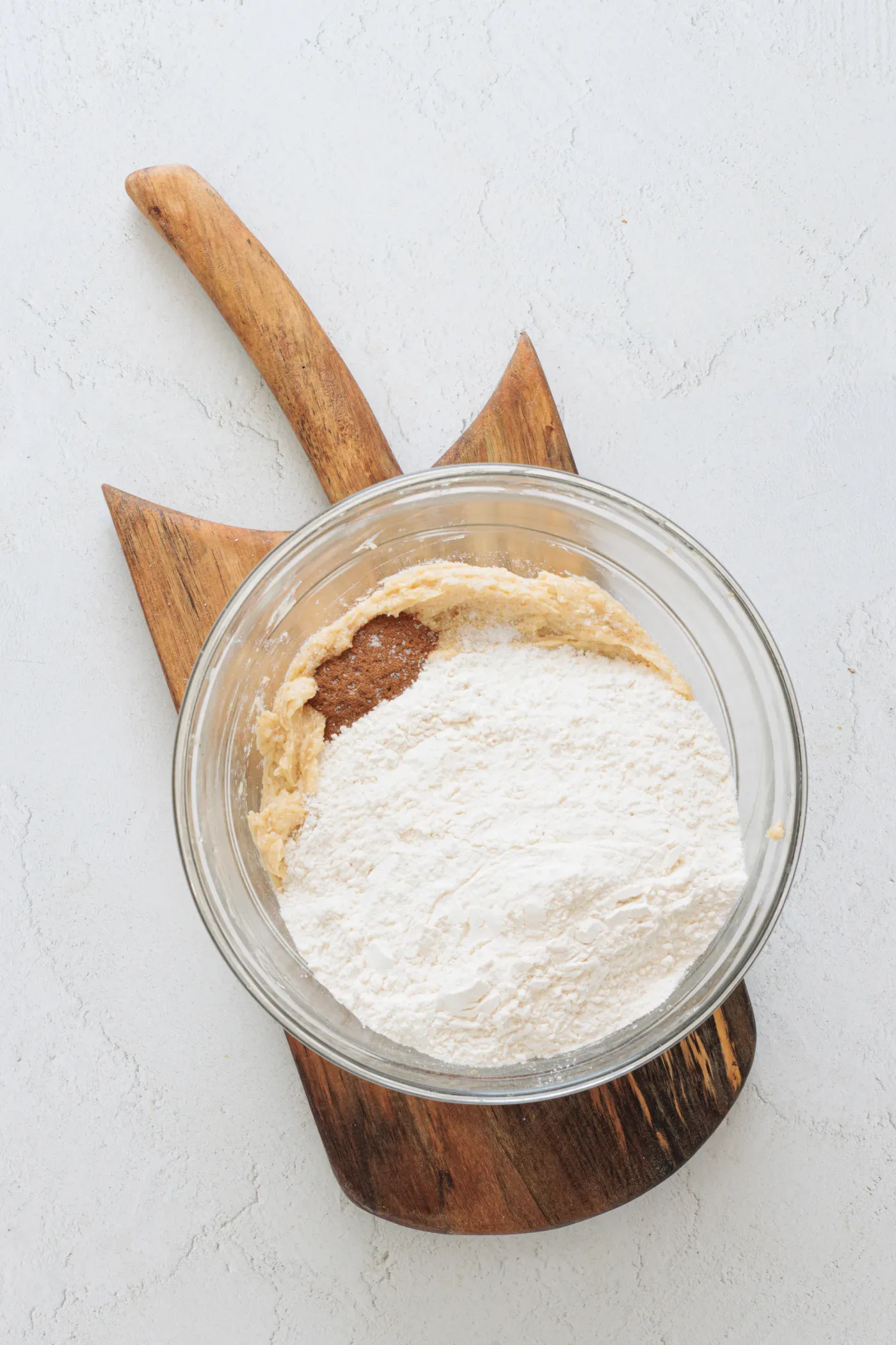 Flour, cinnamon, and baking powder added to the honey cookie mixture