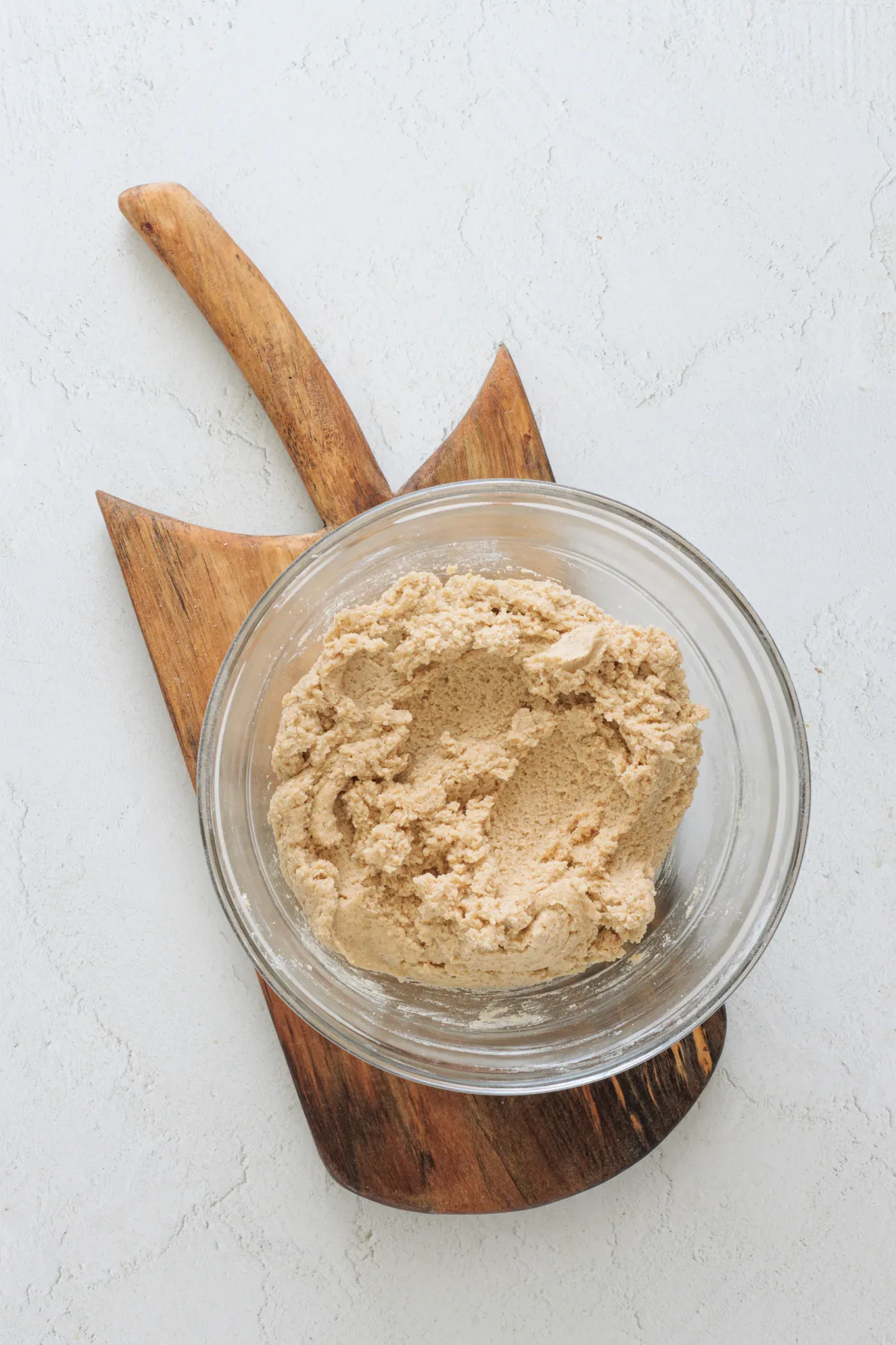 Finished honey cinnamon cookie dough in a glass mixing bowl