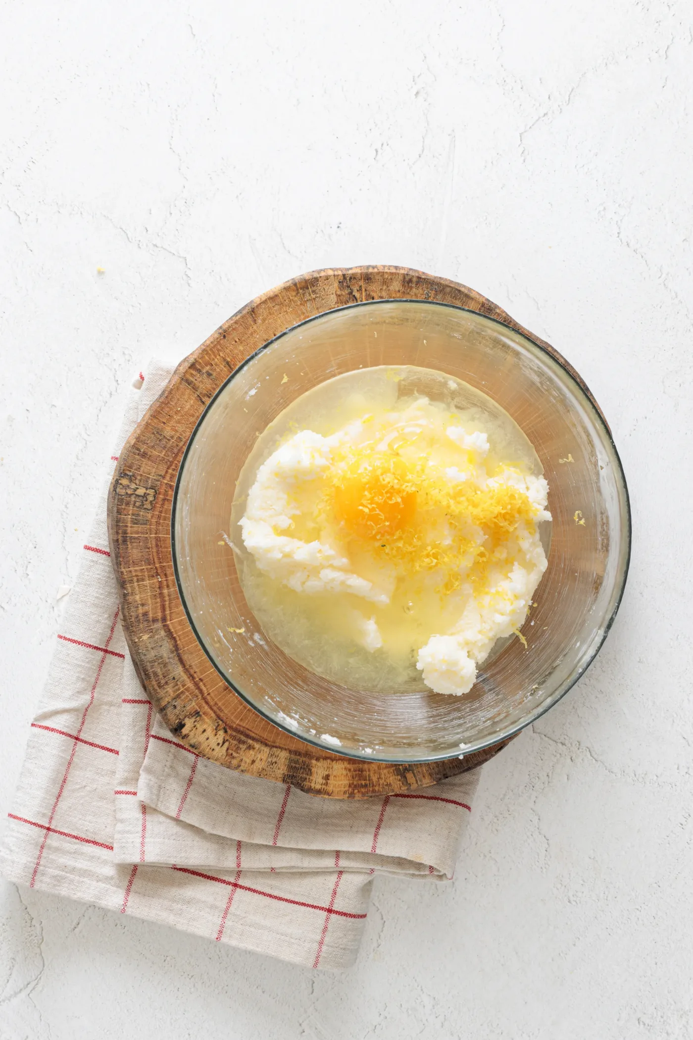 Egg, lemon juice, and lemon zest added to creamed butter and sugar