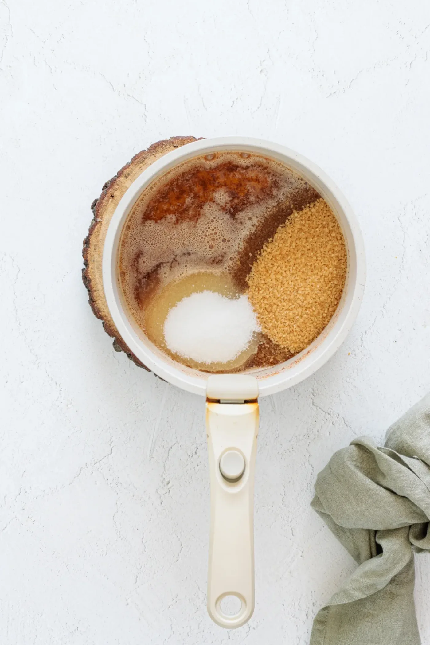 Browned butter with brown sugar and granulated sugar in a saucepan