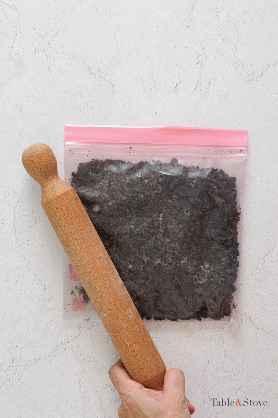 Oreo cookies crushed into crumbs inside a sealed bag