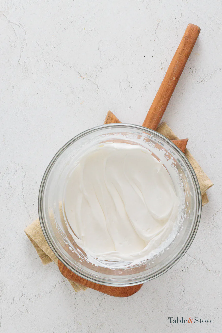 Smooth whipped cream cheese filling in a glass bowl