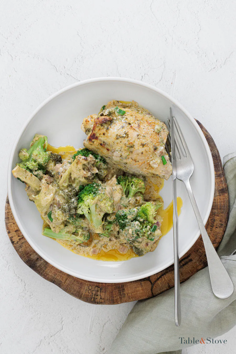 Parmesan ranch chicken and broccoli served on a white plate