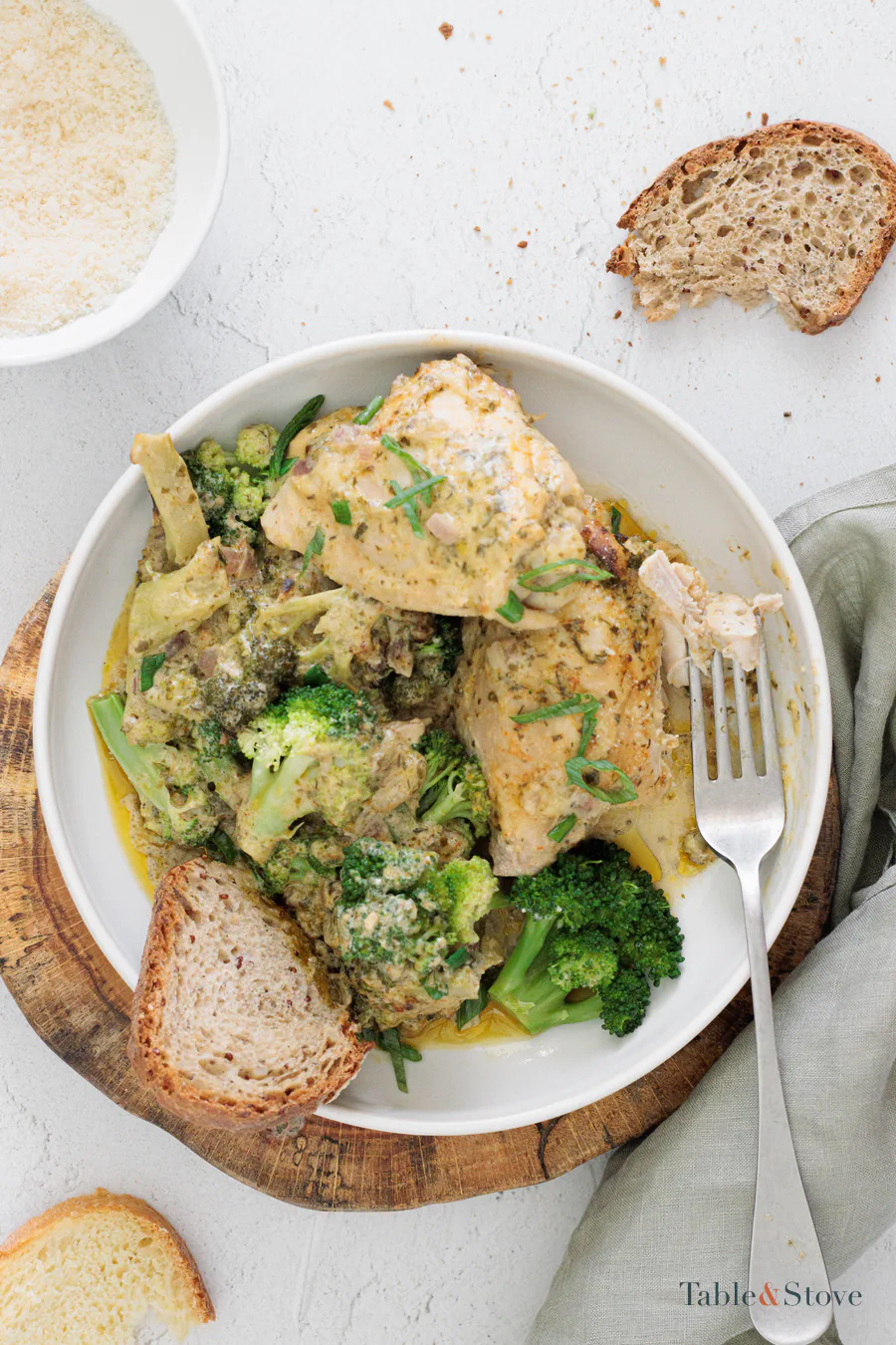 Creamy Parmesan ranch chicken with broccoli and bread on a plate