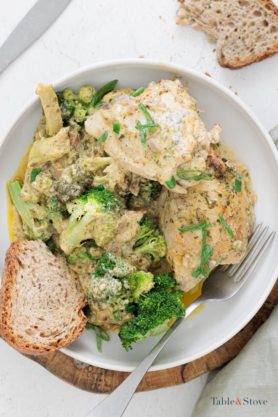 Parmesan ranch chicken thighs with broccoli in a creamy baked sauce