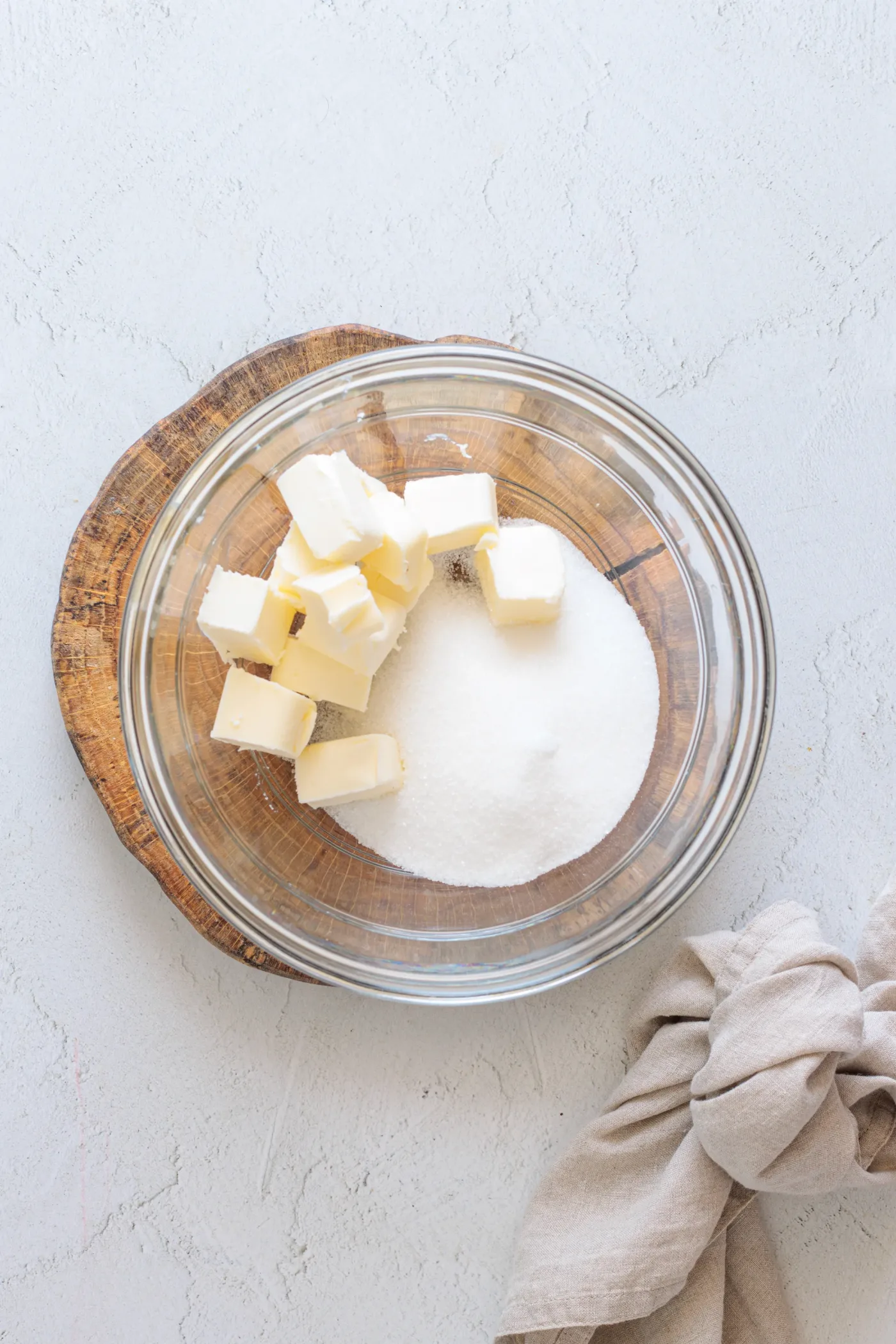 Vegan butter and granulated sugar in a mixing bowl