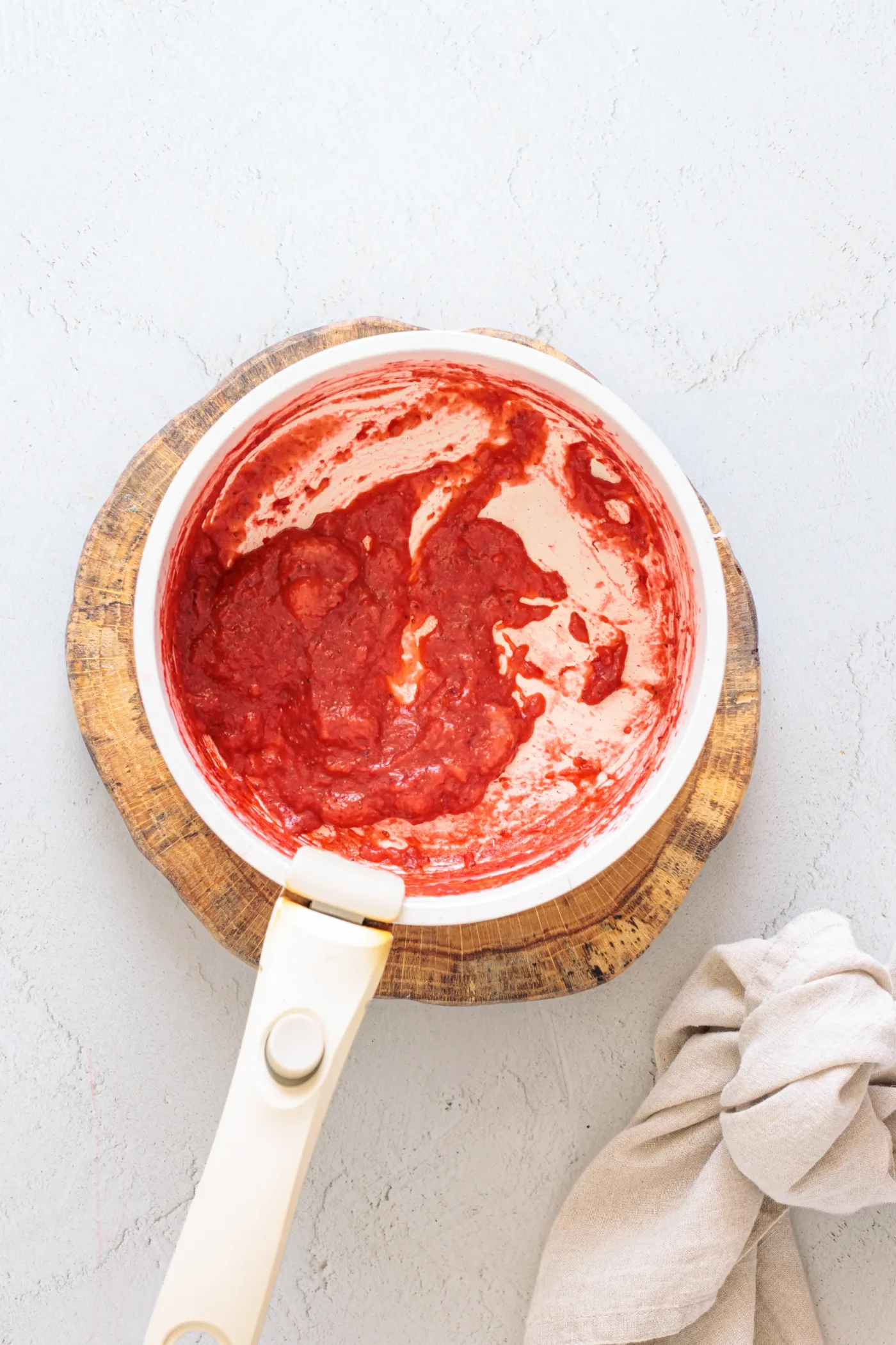 Thick strawberry reduction in a small saucepan