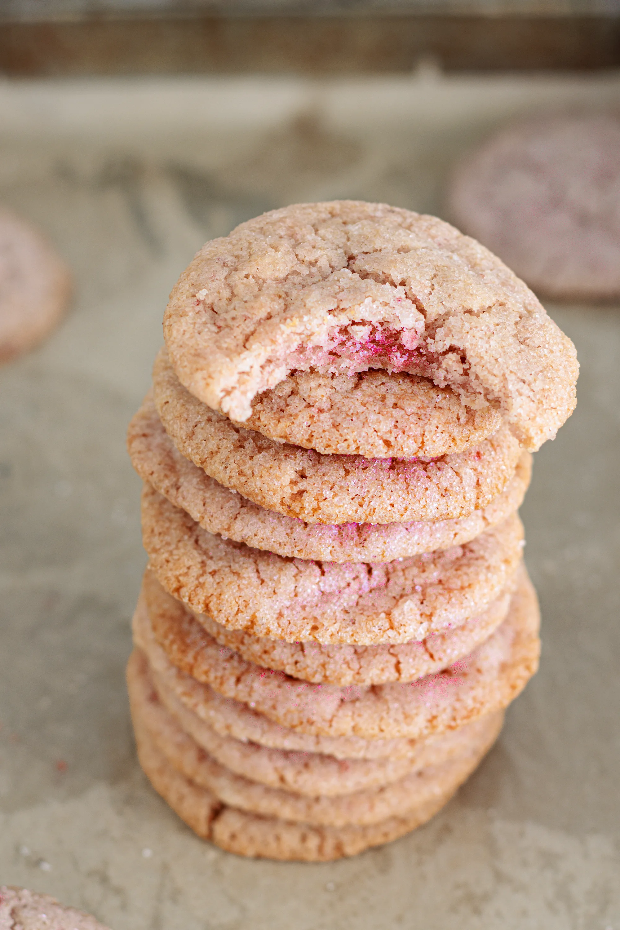 Stack of pink strawberry sugar cookies with crackled sugar-coated tops